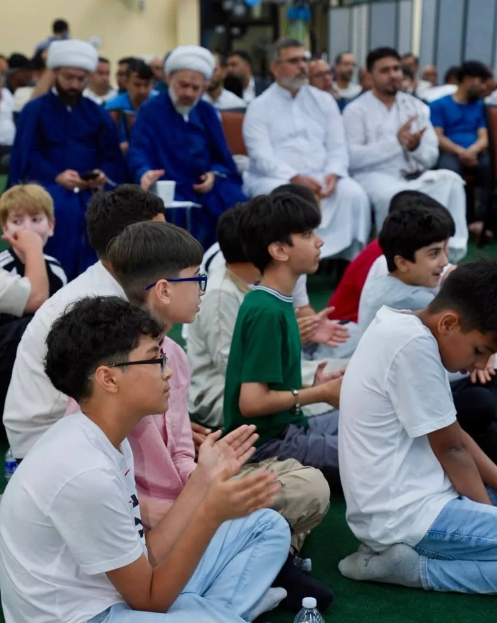 Youth and adults attending a community program at IAC